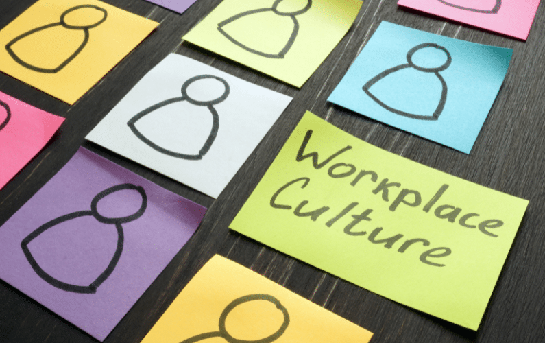 workplace culture represented by stick drawings of people on different colored sticky notes