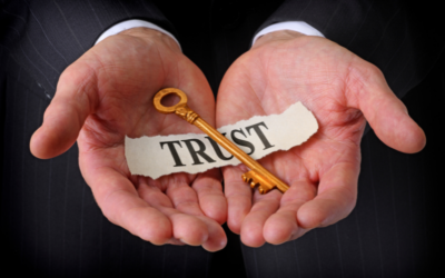 Concept of Trust in ERP Success - Hands Holding a Gold Key and a Paper Labeled Trust