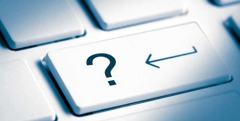Image of a keyboard with an arrow pointing at the question mark key representing there are questions to be answered in ERP leadership